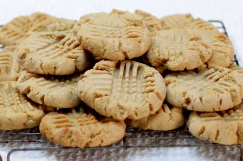 batch of peanut butter cookies sitting on wire rack