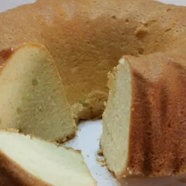 easy homemade pound cake sitting on a white plate on a table