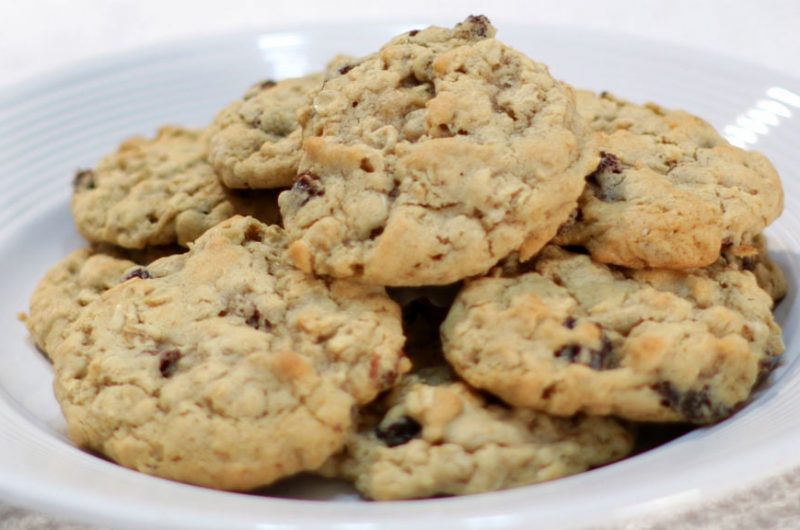 White plate full of homemade chewy oatmeal raisin cookies