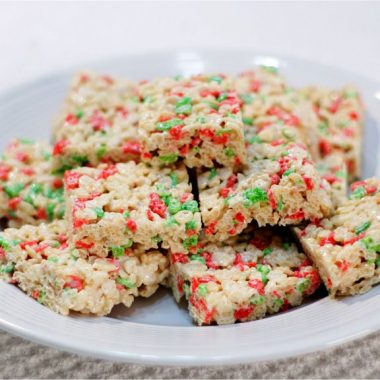 A stack of classic rice krispies treats on a white plate