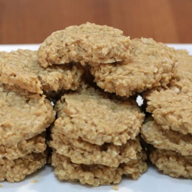 No-bake peanut butter cookies stacked on a plate