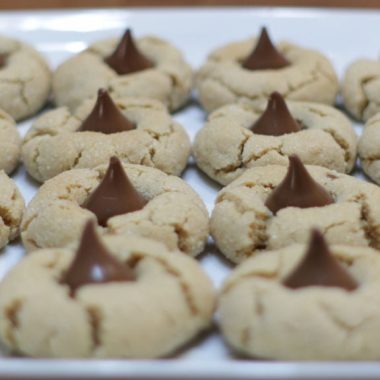 Peanut butter blossoms cookies on a white plate