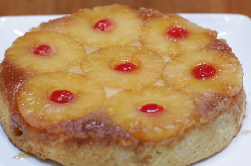 Pineapple upside-down cake on a white square plate