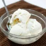 3 ingredient homemade vanilla ice cream in a bowl on a brown towel