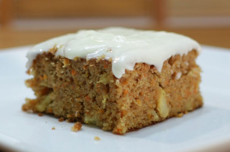Moist carrot cake on a white plate on a table