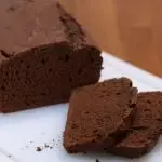 Sliced chocolate bread on top of a white cutting board