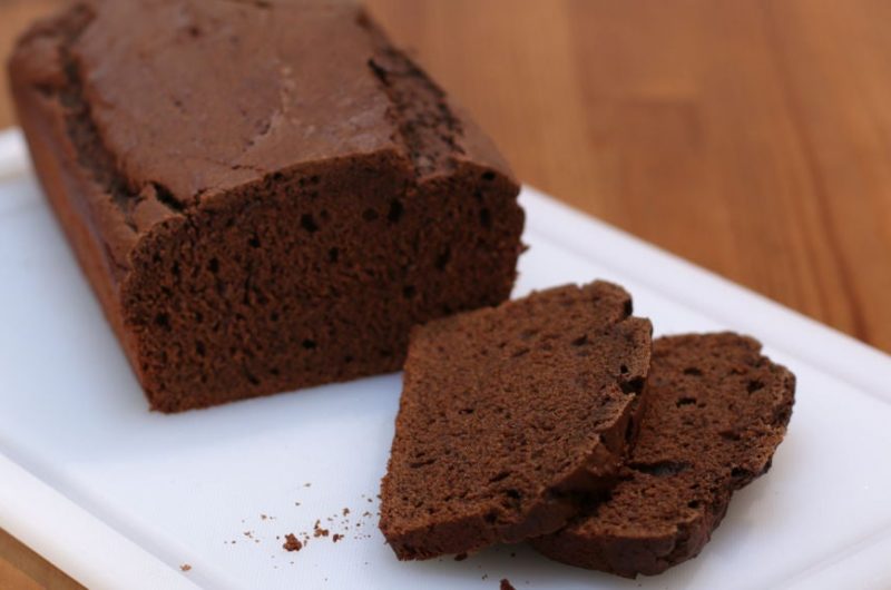 Sliced chocolate bread on top of a white cutting board