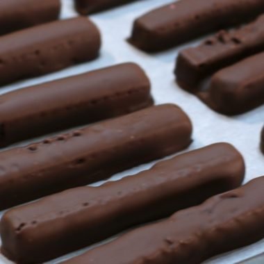 Homemade kit kats bars on a sheet pan lined with parchment paper