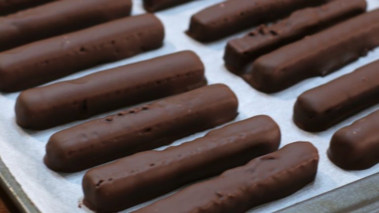 Homemade kit kats bars on a sheet pan lined with parchment paper