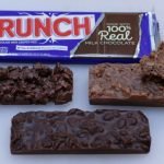 Homemade copycat Nestle crunch bars on a white cutting board.