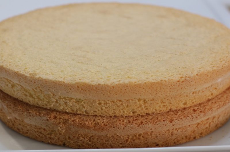 easy 3-ingredient sponge cake layered on a white plate