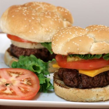 juicy hamburger on white plate