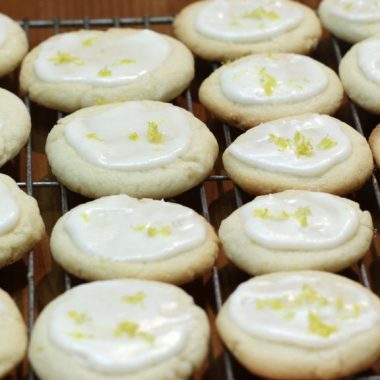 Several lemon butter cookies on a wire rack