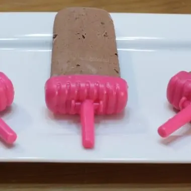 Homemade pudding pops on a white plate