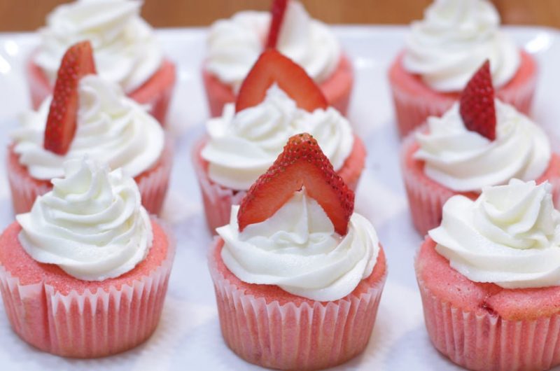 Strawberry cupcakes on a white plate.