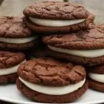 homemade whoopie pies on a plate on picnic table