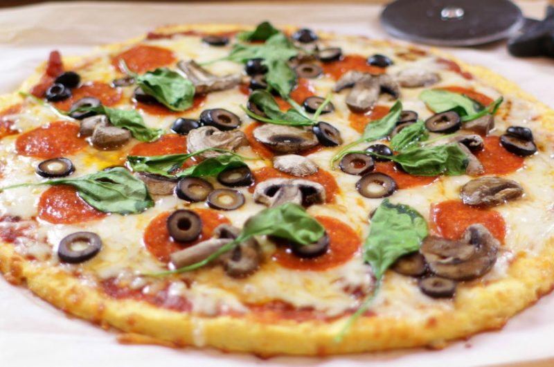 Keto pizza on a piece of parchment paper