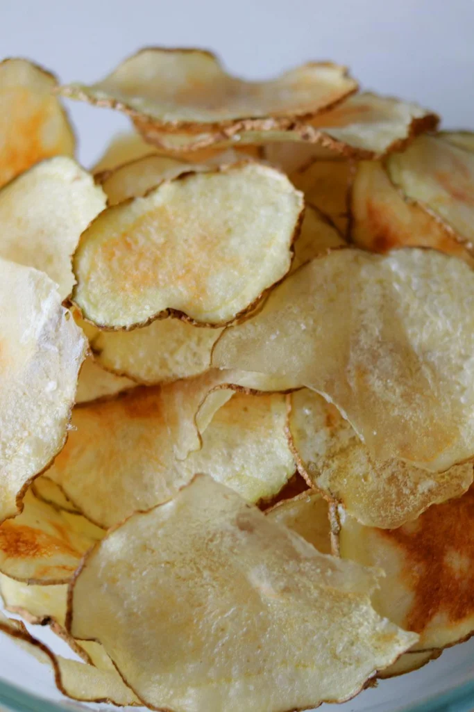 Bowl full of crispy potato chips Bowl full of crispy potato chips