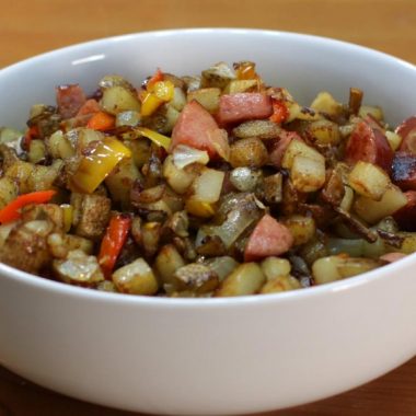 White bowl full of country fried potatoes