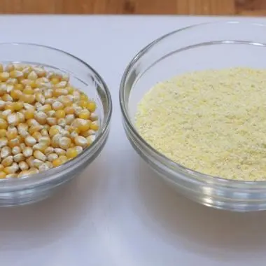 bowl of popcorn kernels next to homemade cornmeal