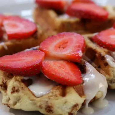 cinnamon roll waffles on a white plate