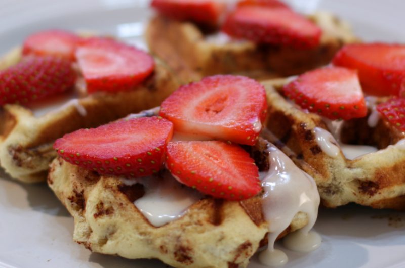cinnamon roll waffles on a white plate