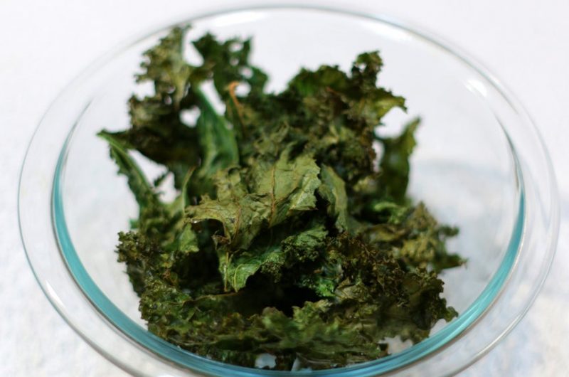 Glass bowl filled with Kale chips