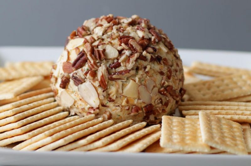 Easy cheese ball on a plate with crackers