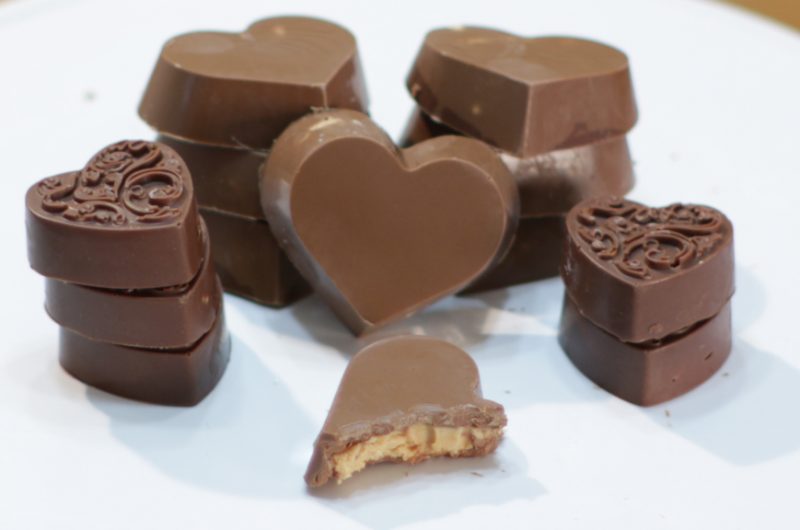 peanut butter cup hearts on a white plate.
