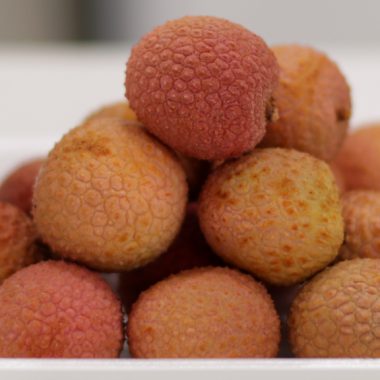 stack of lychee on a white plate