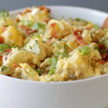 White bowl full of potato salad