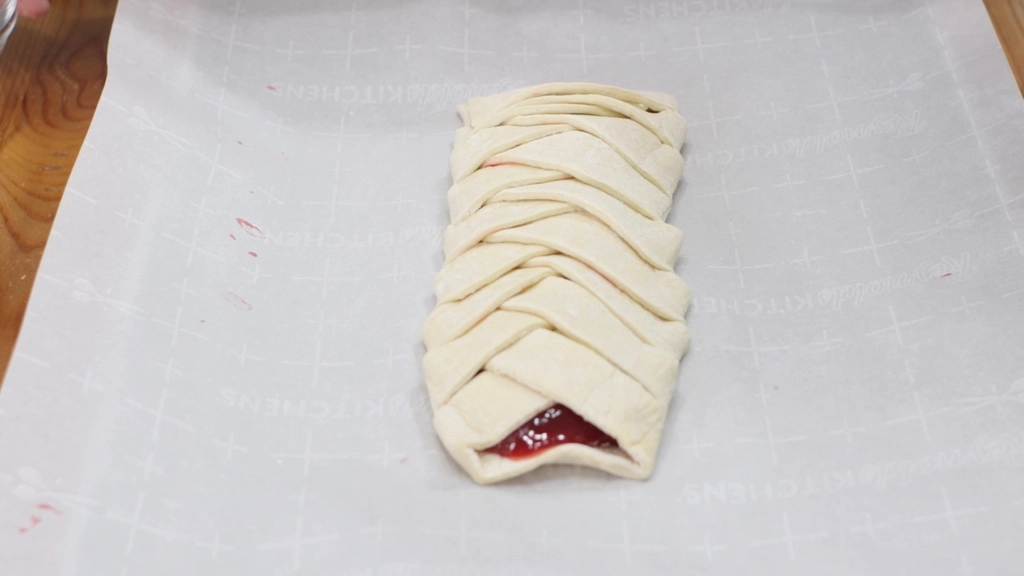 Braided strawberry puff pastry ready to be baked. 