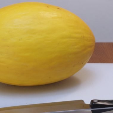 Canary melon on a cutting board