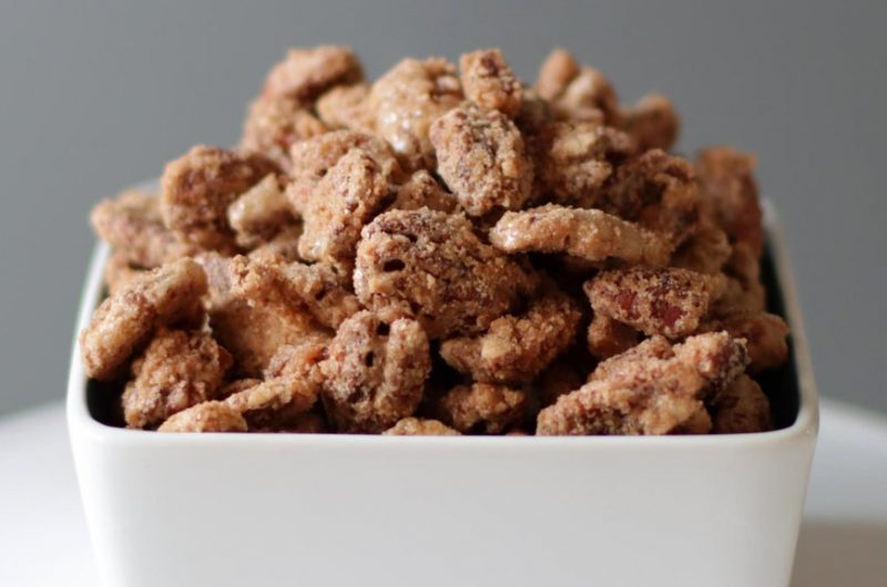 candied pecans in a white dish