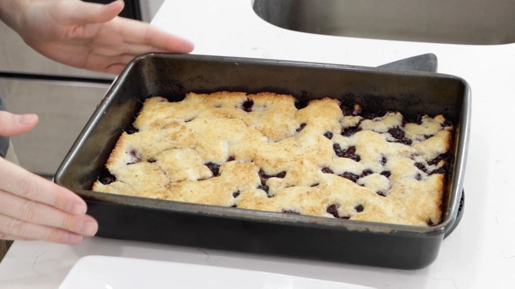 Finished homemade blackberry cobbler in a pan.
