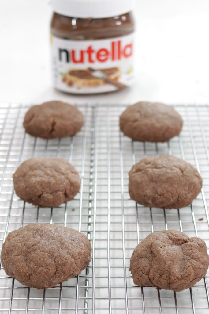 Batch of Nutella cookies on a wire rack.