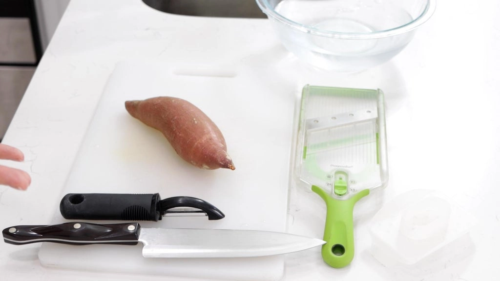 A sweet potato on a cutting board.