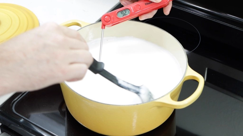 Heating up milk on a stovetop.