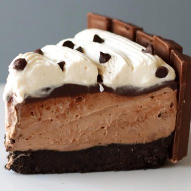 Slice of no-bake chocolate cheesecake on a white plate