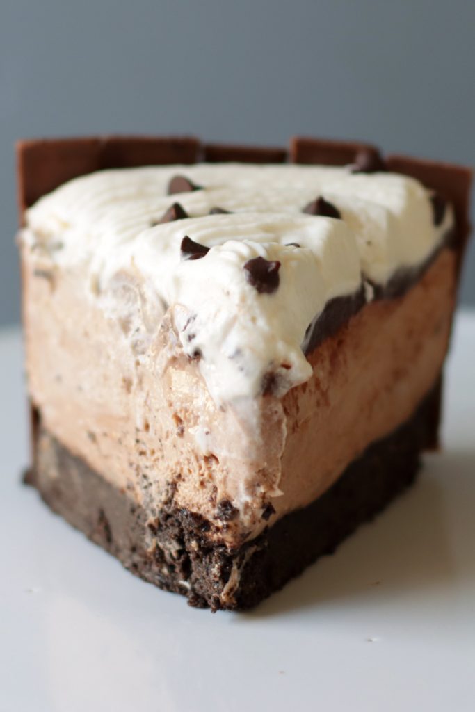Slice of no bake chocolate cheesecake on a white plate