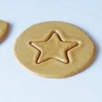 Squid Game Dalgona candy cookie on a white plate