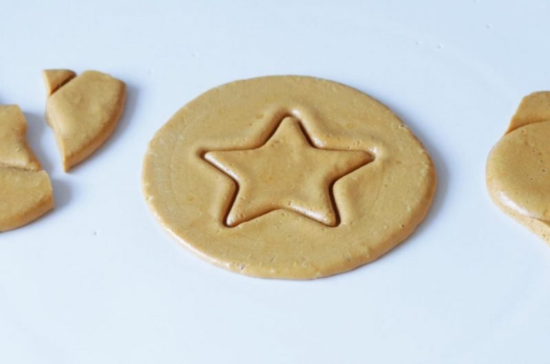 Squid Game Dalgona candy cookie on a white plate