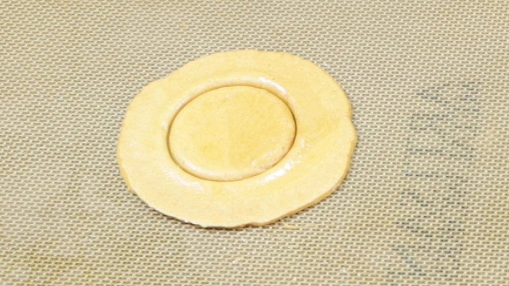 Finished Squid Game Dalgona candy on a silicone mat
