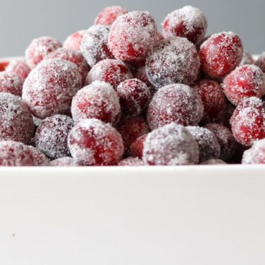 Sugared cranberries in a white bowl