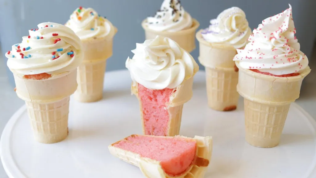 Several ice cream cone cupcakes on a white plate
