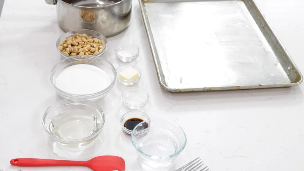 Several ingredients in bowls on a white countertop.