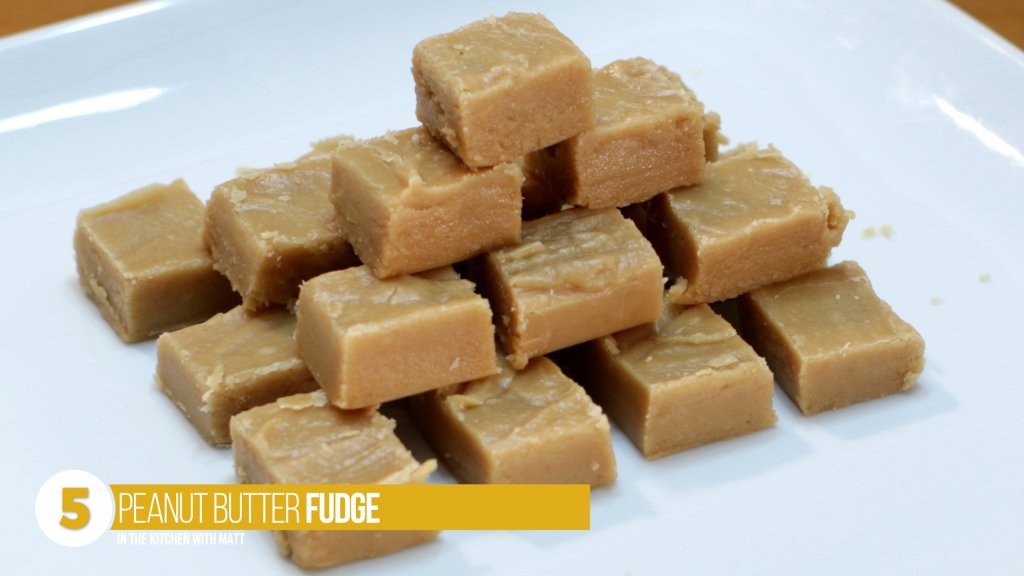 Stack of cubes of peanut butter fudge on a white plate. Number 5 on the top 8 peanut butter recipes list.