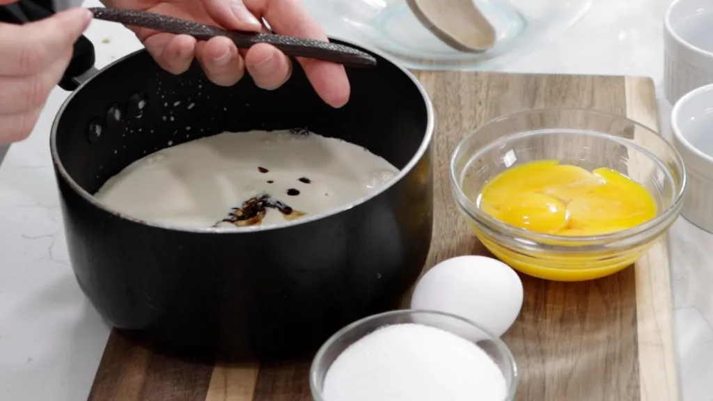 Pot with milk and cream in it.