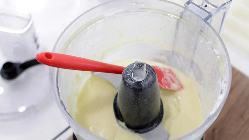 Blended white chocolate in a food processor.
