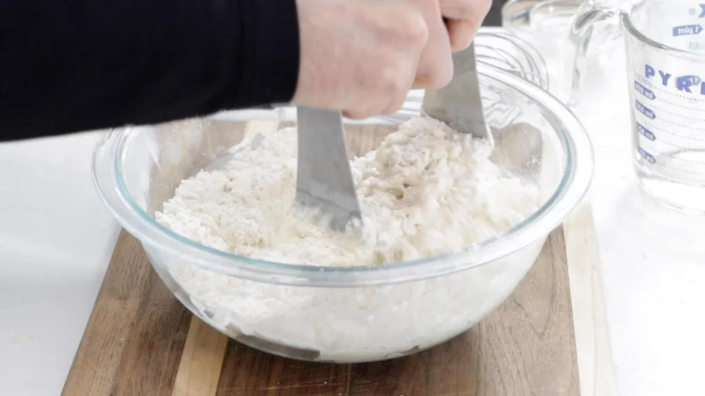 Pastry blender blending up flour with water.